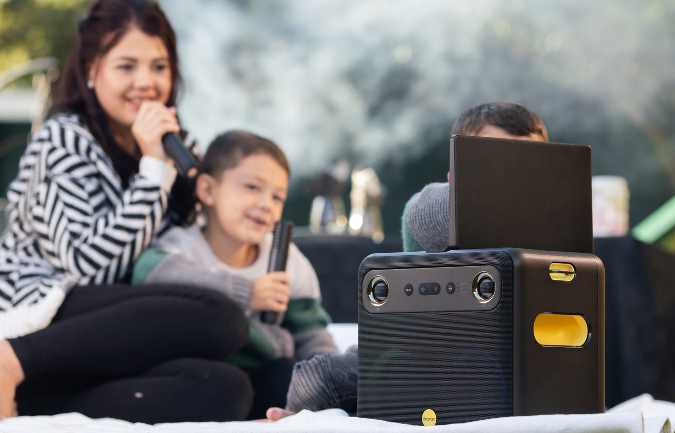 Group of friends singing together using a karaoke machine for an ultimate party